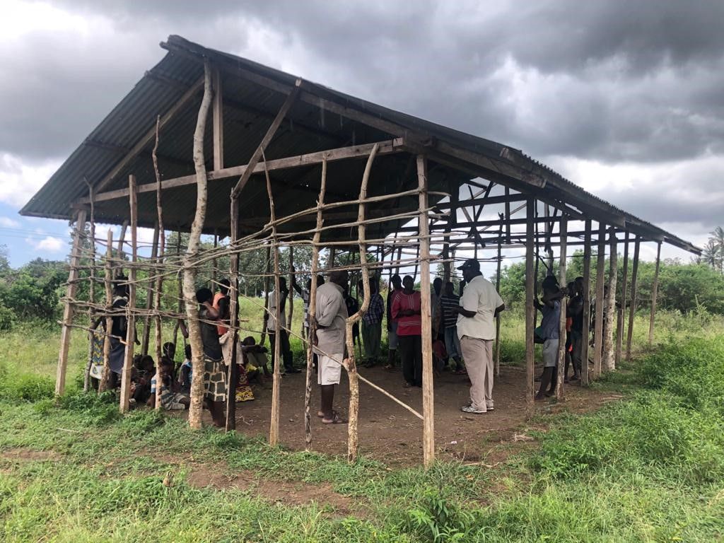 Villagers of Lutsanga in a unfinished building